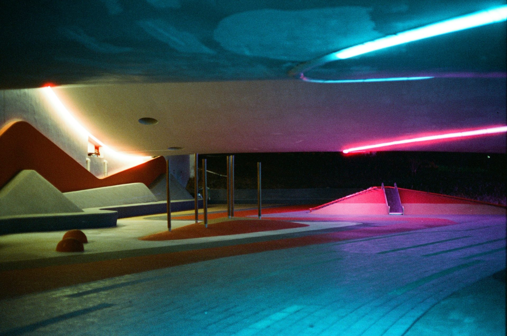 Modern architectural space with neon lighting